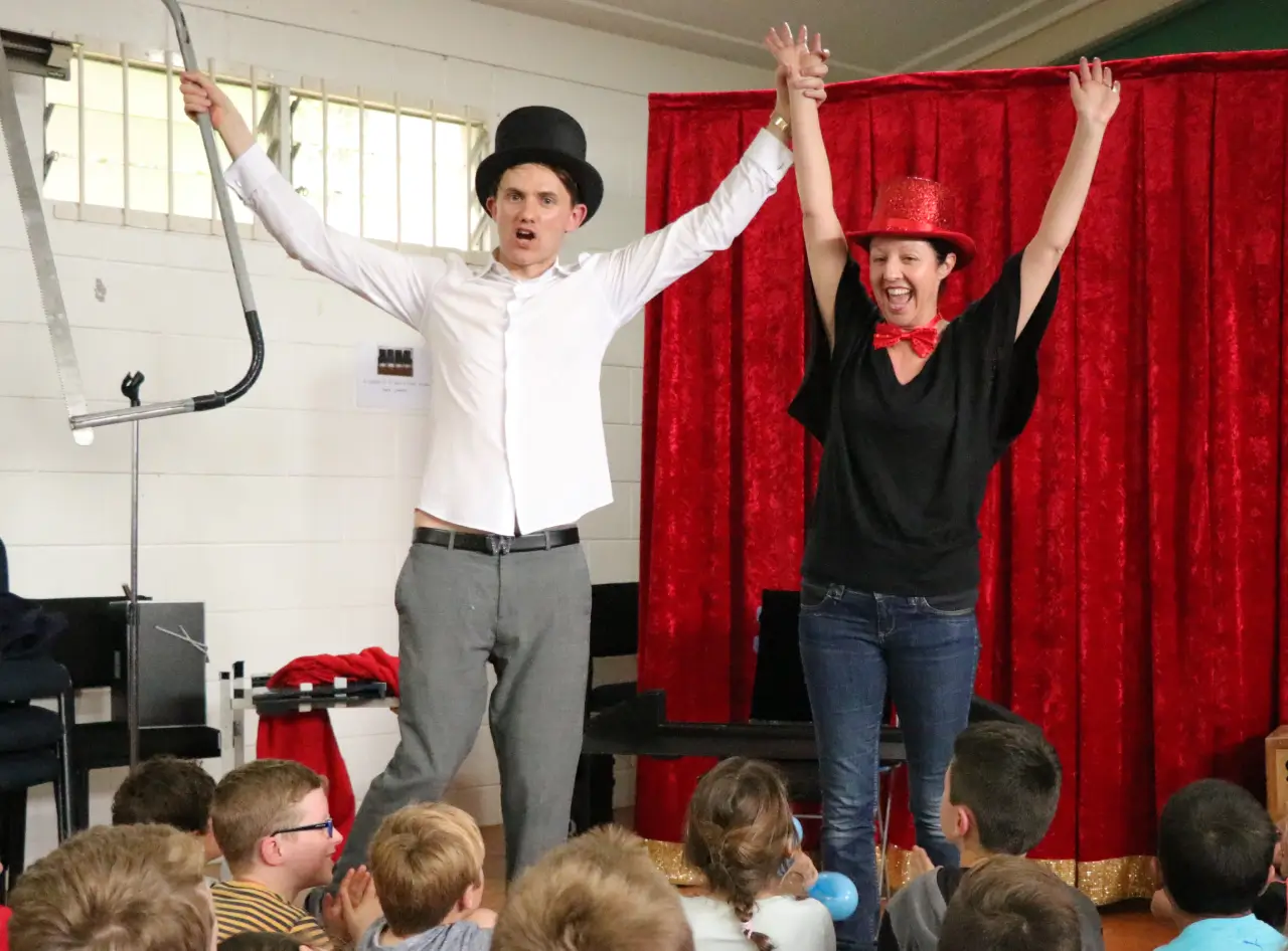 Magician amazes: saws & restores audience member, bows triumphantly.